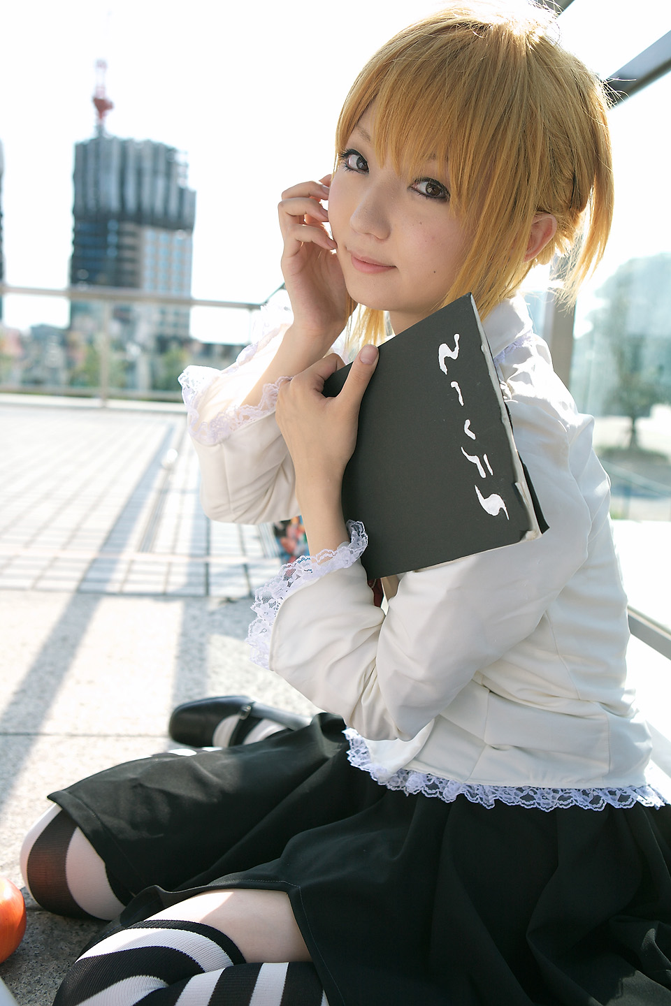 amane_misa blonde_hair book cosplay death_note frills highres photo sitting thighhighs