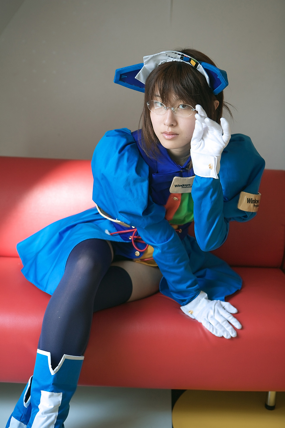1girl 2k 2k-tan blue_legwear cosplay couch glasses gloves highres nami os os-tan pantyhose photo red_couch red_upholstery sitting solo thigh-highs thighhighs white_gloves