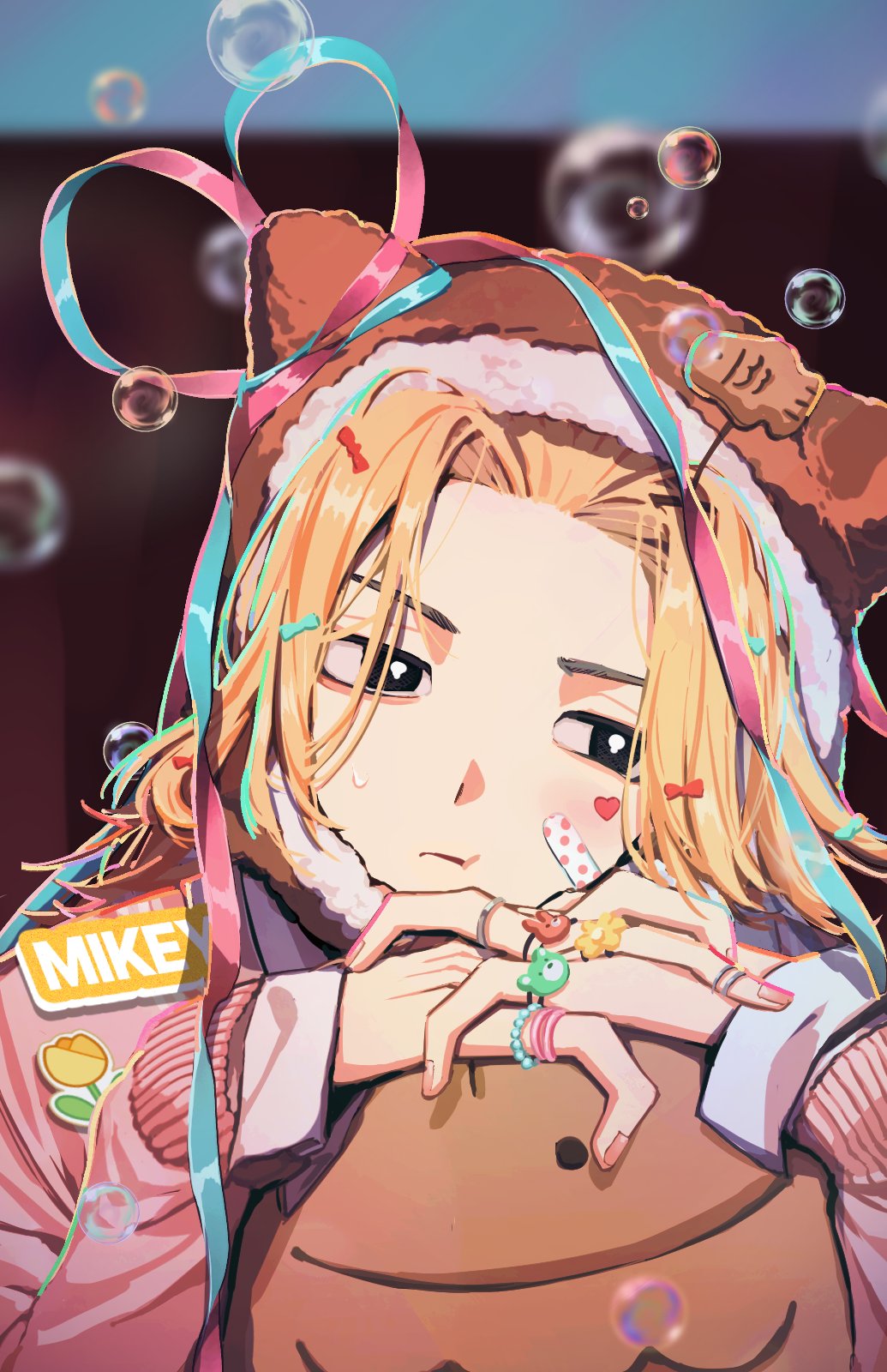 1boy animal_ears bandaid bandaid_on_face black_eyes blonde_hair bubble head_rest highres idol jewelry male_focus name_tag pago0024 ring sano_manjirou sticker_on_face tokyo_revengers