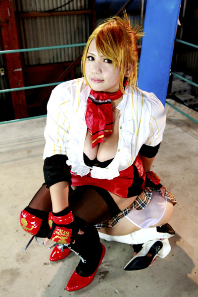 2girls arena asian blonde_hair boxing_ring breasts candy_cane_(rumble_roses) candy_cane_(rumble_roses)_(cosplay) chouzuki_maryou cleavage cosplay large_breasts mistress_spencer mistress_spencer_(cosplay) multiple_girls photo plump rumble_roses rumble_roses_xx sitting sitting_on_person