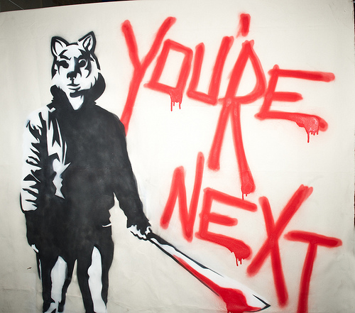 blood english_text feline graffiti machete male mammal melee_weapon solo text threat tiger