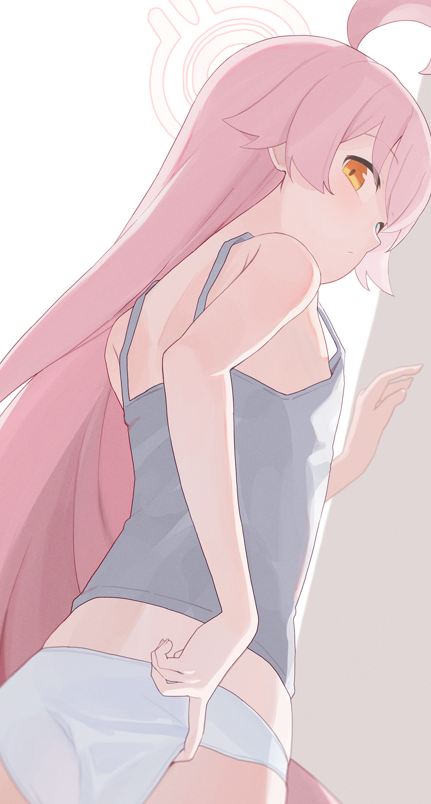 1girl ahoge blue_archive blue_eyes camisole commentary flat_chest from_behind grey_camisole halo heterochromia highres hiroki_(yyqw7151) hoshino_(blue_archive) long_hair looking_at_viewer looking_back panties pink_hair sleeveless solo underwear very_long_hair white_panties yellow_eyes