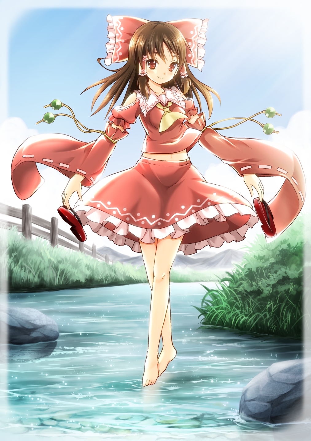 adapted_costume ascot bare_shoulders barefoot blue_sky bow brown_hair cloud day detached_sleeves fujishima_shinnosuke grass hair_bow hair_tubes hakurei_reimu highres holding holding_shoes long_hair looking_at_viewer midriff mountain navel outdoors railing red_eyes rock shoes shoes_removed skirt skirt_set sky smile solo stream tiptoes touhou walking walking_on_liquid