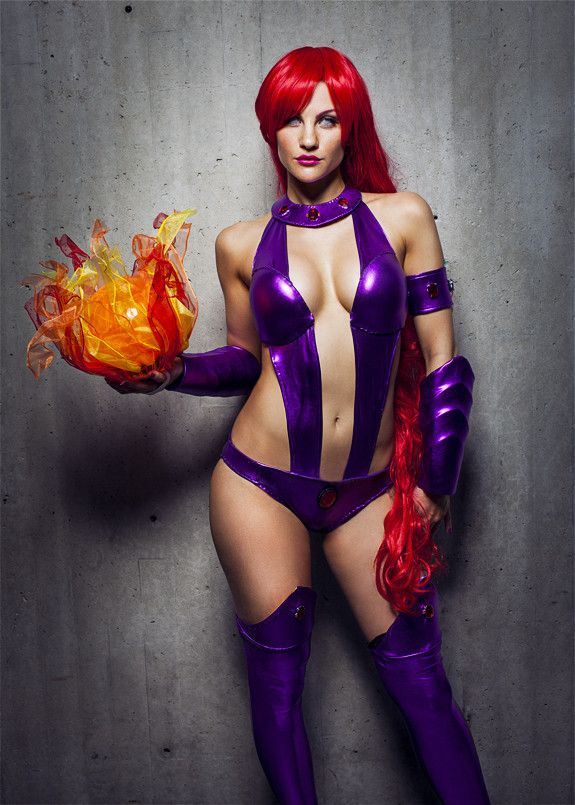 1girl cosplay dc_comics photo red_hair solo standing starfire starfire_(cosplay) thighhighs vambraces