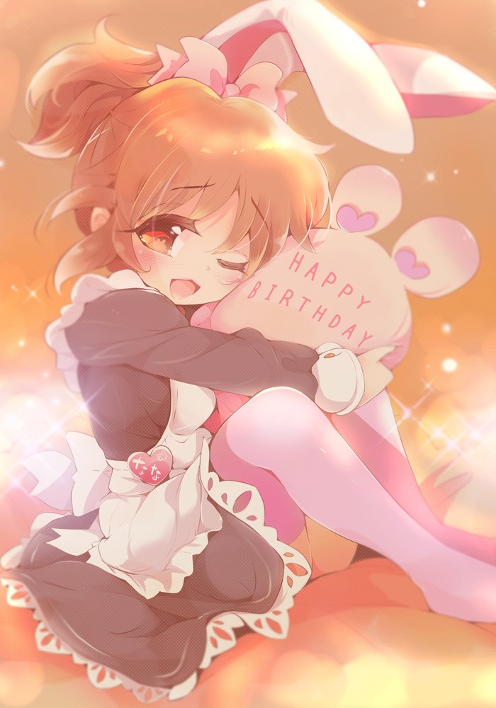 abe_nana animal_ears apron black_dress blush bow brown_eyes brown_hair bunny_ears commentary_request dress eyebrows_visible_through_hair fake_animal_ears feet_out_of_frame hair_bow happy_birthday heart idolmaster idolmaster_cinderella_girls long_hair looking_at_viewer maid_apron no_shoes one_eye_closed open_mouth pillow pillow_hug pink_bow pink_legwear ponytail sitting smile solo sparkle thighhighs usoneko