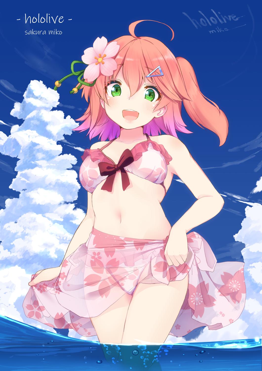 1girl ahoge alternate_costume bangs bare_shoulders bikini blue_sky character_name cherry_blossom_print cherry_blossoms cloud cloudy_sky flower frilled_bikini frilled_bikini_top frills from_below green_eyes hair_flower hair_ornament hairclip highres hololive looking_at_viewer medium_hair navel nejime one_side_up open_mouth outdoors partially_submerged pink_bikini pink_bikini_bottom pink_bikini_top pink_hair sakura_miko sky smile solo swimsuit thighs virtual_youtuber water