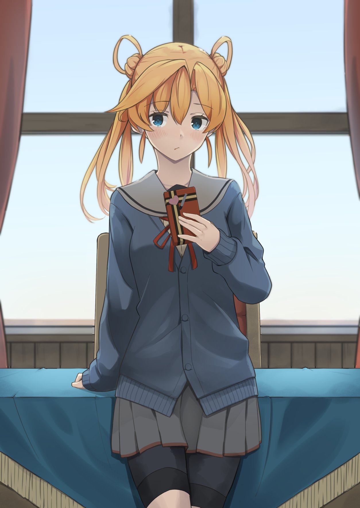 1girl abukuma_(kancolle) bike_shorts black_shorts blonde_hair blue_eyes blush box buttons closed_mouth cowboy_shot eyebrows_visible_through_hair gift gift_box grey_sailor_collar grey_skirt hair_between_eyes hair_rings highres holding holding_gift kantai_collection long_hair long_sleeves negahami pleated_skirt sailor_collar shorts shorts_under_skirt skirt solo valentine window