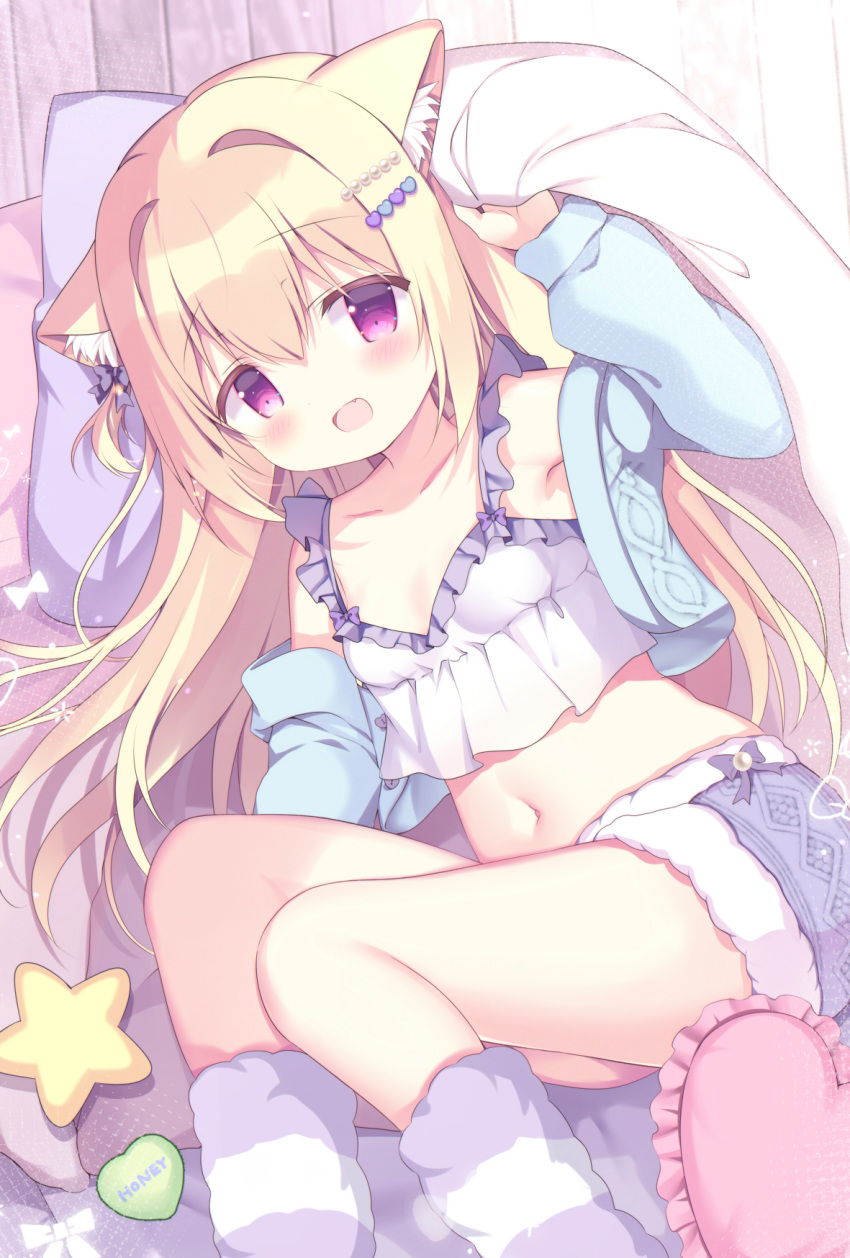 1girl animal_ear_fluff animal_ears azumi_kazuki bare_shoulders blonde_hair blue_jacket blush breasts camisole collarbone commentary_request cropped_jacket feet_out_of_frame frilled_pillow frills fur-trimmed_shorts fur_trim hair_ornament hairclip heart heart_pillow highres jacket long_hair long_sleeves looking_at_viewer melonbooks midriff navel open_mouth original pillow puffy_long_sleeves puffy_sleeves purple_eyes short_shorts shorts small_breasts solo white_camisole