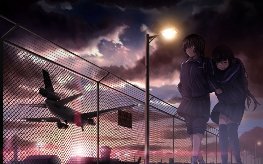 2girls 99_(hosinosensei) aircraft airplane airport black_hair black_legwear black_skirt black_sky blue_sky chain-link_fence closed_eyes cloud cloudy_sky commentary_request dc-10 fence from_below highres jacket lamppost landing long_hair looking_to_the_side multiple_girls original outdoors over-kneehighs pants short_hair sign skirt sky socks sunset thighhighs track_jacket track_pants track_suit walking warning_sign white_legwear