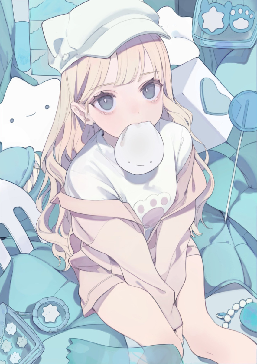 1girl animal_ears bags_under_eyes bangs baozi beads between_legs blonde_hair blue_eyes candy cat_ears cube fake_animal_ears feet_out_of_frame food food_in_mouth fork from_above hair_behind_ear hand_between_legs hat hat_with_ears heart highres jacket lollipop long_sleeves looking_at_viewer looking_up macaron mouth_hold off_shoulder original oversized_food oversized_object paw_print print_shirt shirt sitting solo star_(symbol) stuffed_toy t-shirt tokiwata_soul transparent wavy_hair white_headwear white_shirt