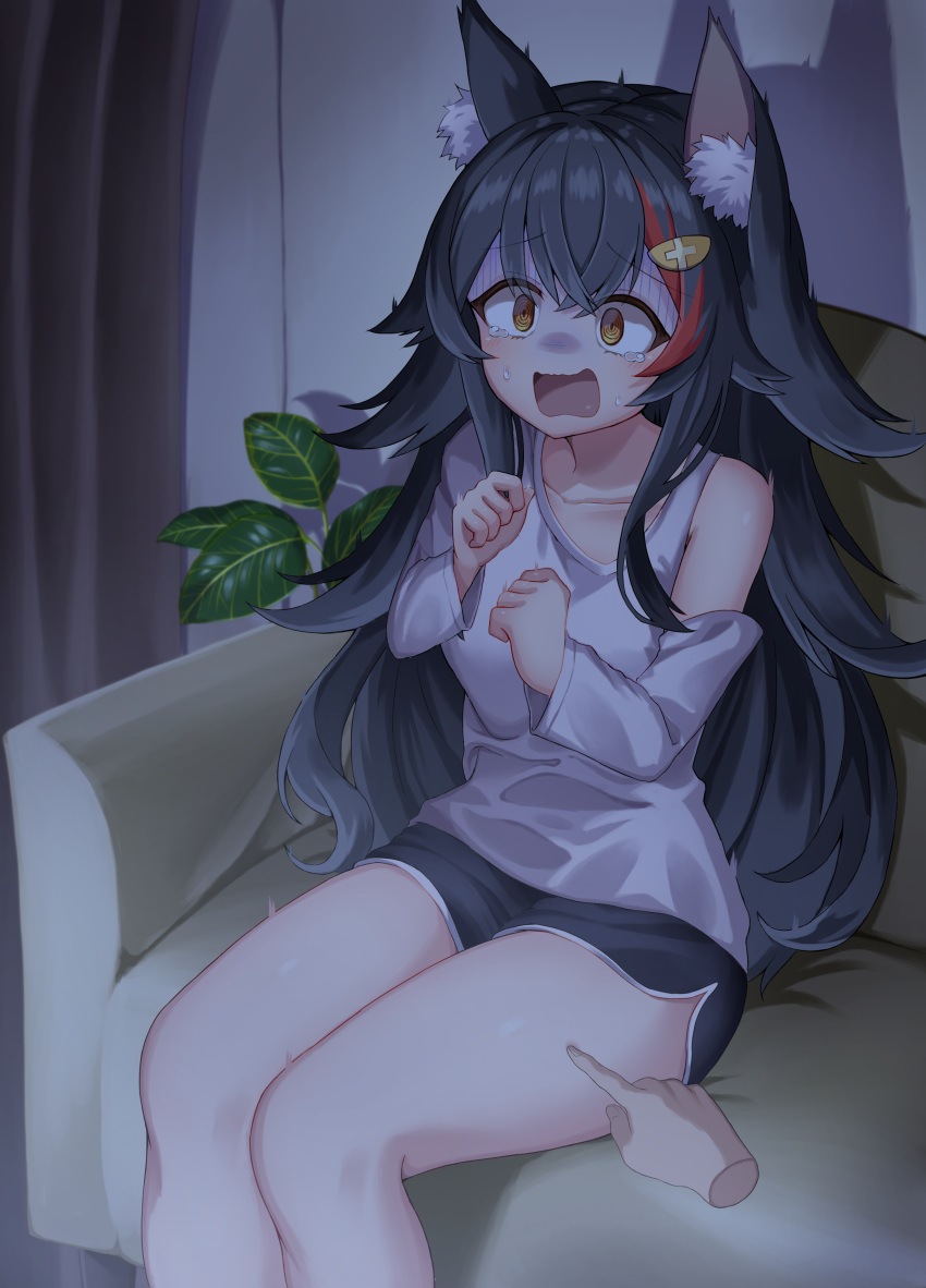 1girl absurdres animal_ear_fluff animal_ears asymmetrical_clothes asymmetrical_shirt black_hair black_shorts clothing_cutout couch disembodied_limb flipped_hair hair_ornament hairclip highres hololive indoors kajitsu_no_hito living_room long_hair long_sleeves multicolored_hair on_couch ookami_mio red_hair scared shirt short_shorts shorts shoulder_cutout sidelocks sitting solo_focus spiked_hair streaked_hair tearing_up very_long_hair virtual_youtuber white_shirt wolf_ears wolf_girl