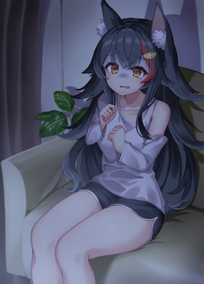 1girl absurdres animal_ear_fluff animal_ears asymmetrical_clothes asymmetrical_shirt black_hair black_shorts clothing_cutout couch flipped_hair gloom_(expression) hair_ornament hairclip highres hololive indoors kajitsu_no_hito living_room long_hair long_sleeves multicolored_hair on_couch ookami_mio red_hair scared shirt short_shorts shorts shoulder_cutout sidelocks sitting solo spiked_hair streaked_hair tearing_up very_long_hair virtual_youtuber white_shirt wolf_ears wolf_girl