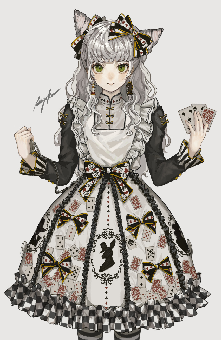 1girl absurdres bangs blunt_bangs bow card checkered commentary_request cone_hair_bun dress green_eyes hair_bow hair_bun highres holding holding_card holding_pocket_watch long_hair long_sleeves looking_at_viewer original playing_card pocket_watch sayosny2 solo striped striped_legwear watch white_dress
