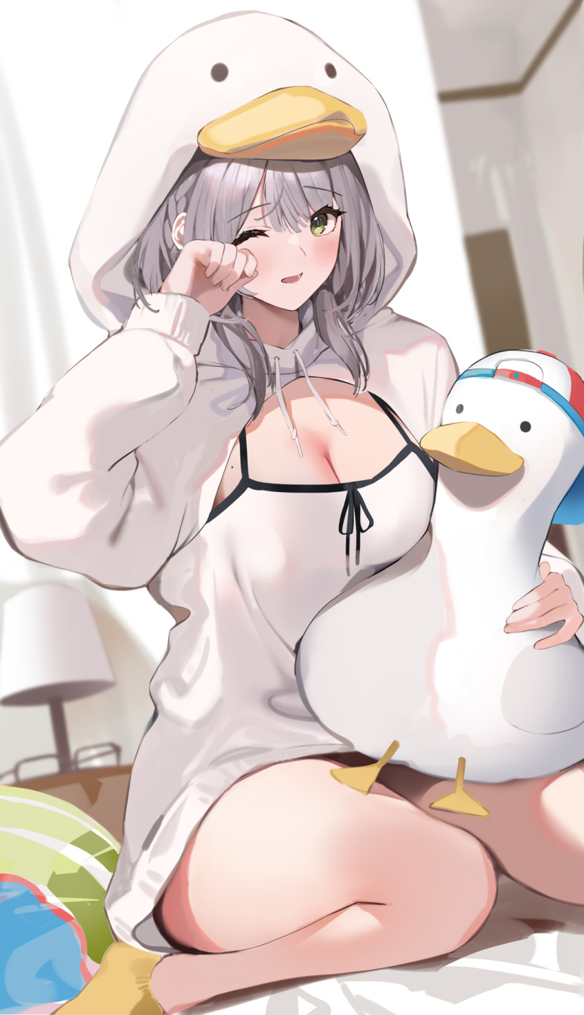 1girl bangs bare_legs blurry blurry_background blush breasts cleavage drawstring duck_hood eyewear_removed glasses green_eyes grey_hair hand_up highres hololive hood hood_up hoodie indoors lamp large_breasts long_sleeves looking_at_viewer mole mole_on_breast niii_(memstapak) one_eye_closed rubbing_eyes shirogane_noel sitting socks solo stuffed_animal stuffed_duck stuffed_toy subaru_duck virtual_youtuber wariza white_hoodie yellow_legwear