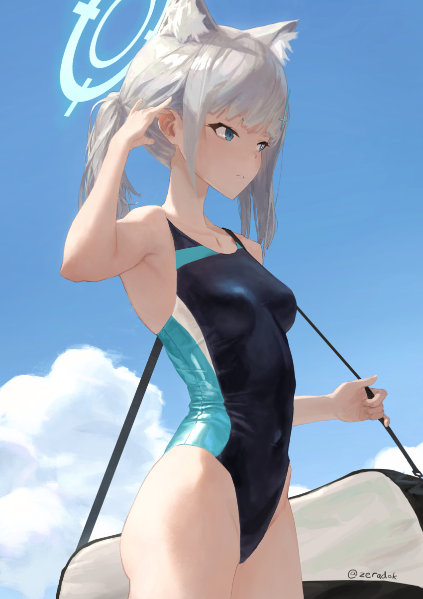 1girl animal_ear_fluff animal_ears arm_up armpits bag bangs bare_arms bare_shoulders black_swimsuit blue_archive blue_eyes blue_sky blunt_bangs breasts cat_ears closed_mouth collarbone commentary competition_swimsuit covered_navel cowboy_shot day duffel_bag grey_hair halo highres medium_breasts one-piece_swimsuit outdoors shiroko_(blue_archive) short_hair short_ponytail sky solo swimsuit twitter_username zeradok