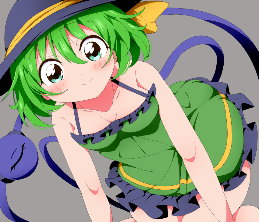 1girl absurdres adapted_costume bangs black_headwear blush breasts bwell cleavage closed_mouth commentary_request dress eyeball feet_out_of_frame frilled_dress frills green_dress green_eyes green_hair grey_background hair_between_eyes hat hat_ribbon highres komeiji_koishi looking_at_viewer ribbon short_hair simple_background sleeveless sleeveless_dress small_breasts smile solo sundress third_eye touhou yellow_ribbon