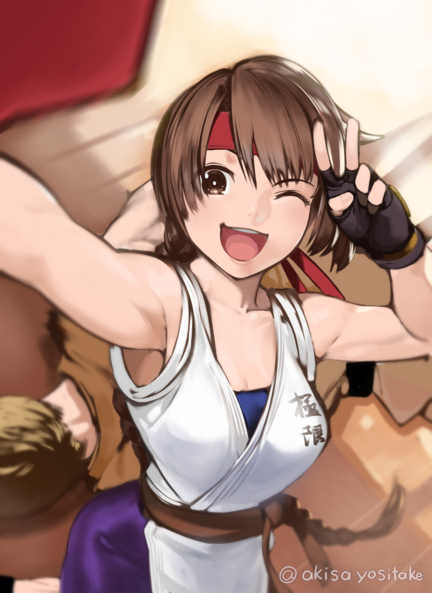 1boy 1girl akisa_(12023648) armpits black_gloves blush braid braided_ponytail brown_eyes brown_hair collarbone fingerless_gloves gloves hair_ribbon hands_up highres long_hair muscular muscular_female one_eye_closed open_mouth red_ribbon ribbon selfie simple_background solo_focus star_(symbol) the_king_of_fighters twitter_username v wooden_floor yuri_sakazaki