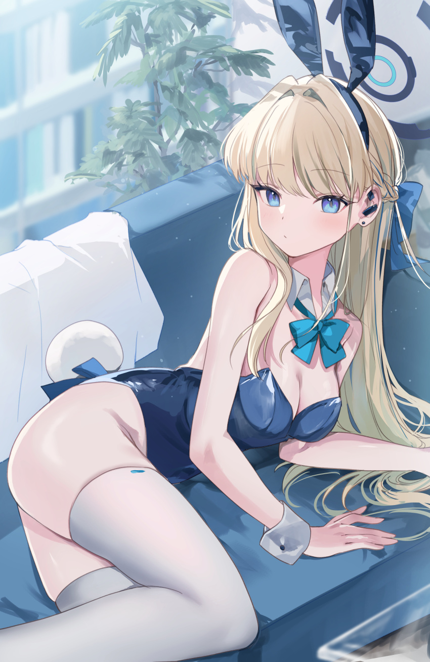 1girl absurdres animal_ears blonde_hair blue_archive blue_bow blue_bowtie blue_eyes blue_hair blue_halo blue_leotard blush bow bowtie braid breasts cleavage closed_mouth couch detached_collar fake_animal_ears fake_tail halo highres indoors leotard long_hair medium_breasts multicolored_hair official_alternate_costume rabbit_ears rabbit_tail solo strapless strapless_leotard streaked_hair tail thighhighs toki_(blue_archive) toki_(bunny)_(blue_archive) ume_(plumblossom) white_thighhighs wrist_cuffs