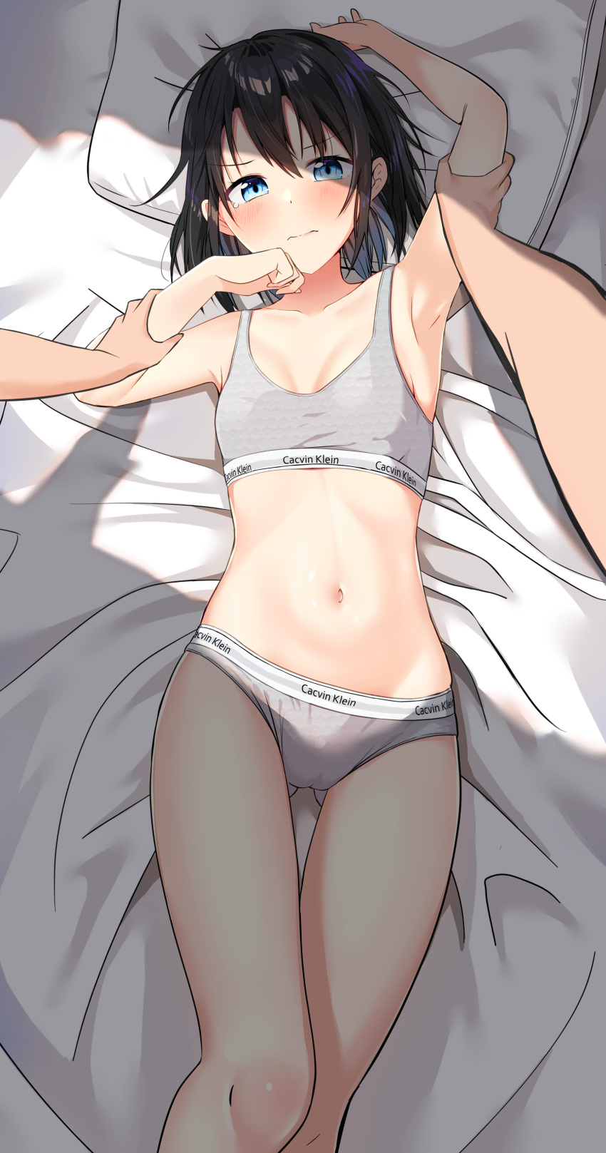 1boy 1girl absurdres arm_up armpits bare_arms bare_shoulders bed_sheet black_hair blue_eyes bra breasts cac_itinose calvin_klein closed_mouth collarbone feet_out_of_frame grey_bra grey_panties hair_between_eyes hand_up highres lying on_back original panties pillow shadow small_breasts solo_focus tears underwear underwear_only
