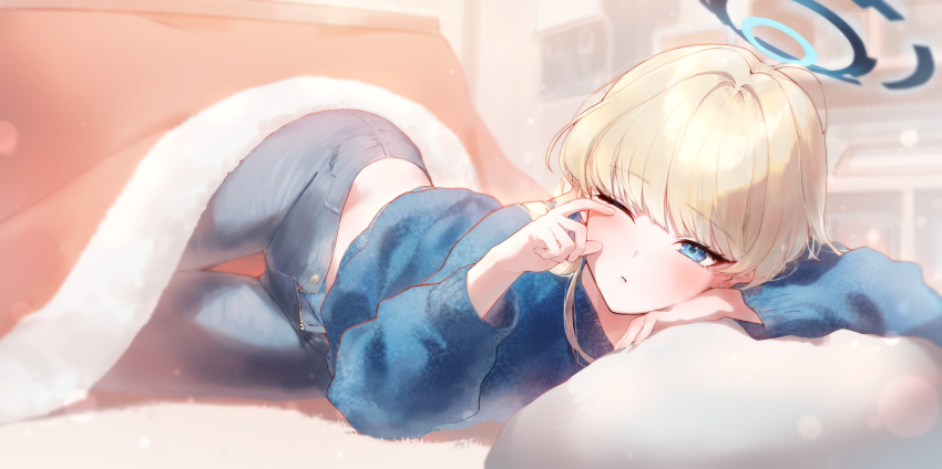 1girl absurdres alternate_costume blonde_hair blue_archive blue_eyes blue_halo blue_sweater blush commentary_request eshineko grey_pants halo highres indoors kotatsu long_hair long_sleeves lying on_stomach open_fly pants puffy_long_sleeves puffy_sleeves rubbing_eyes solo sweater table toki_(blue_archive) waking_up