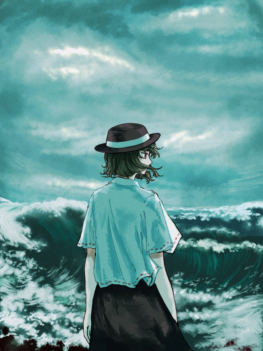 1girl bangs black_hair black_headwear black_skirt brown_eyes cloud cloudy_sky commentary_request fedora feet_out_of_frame foaming_waves from_behind grey_sky hair_over_mouth hair_ribbon hat highres kihaji140 looking_to_the_side ocean ribbon shirt short_hair short_sleeves skirt sky solo touhou usami_renko waves white_ribbon white_shirt