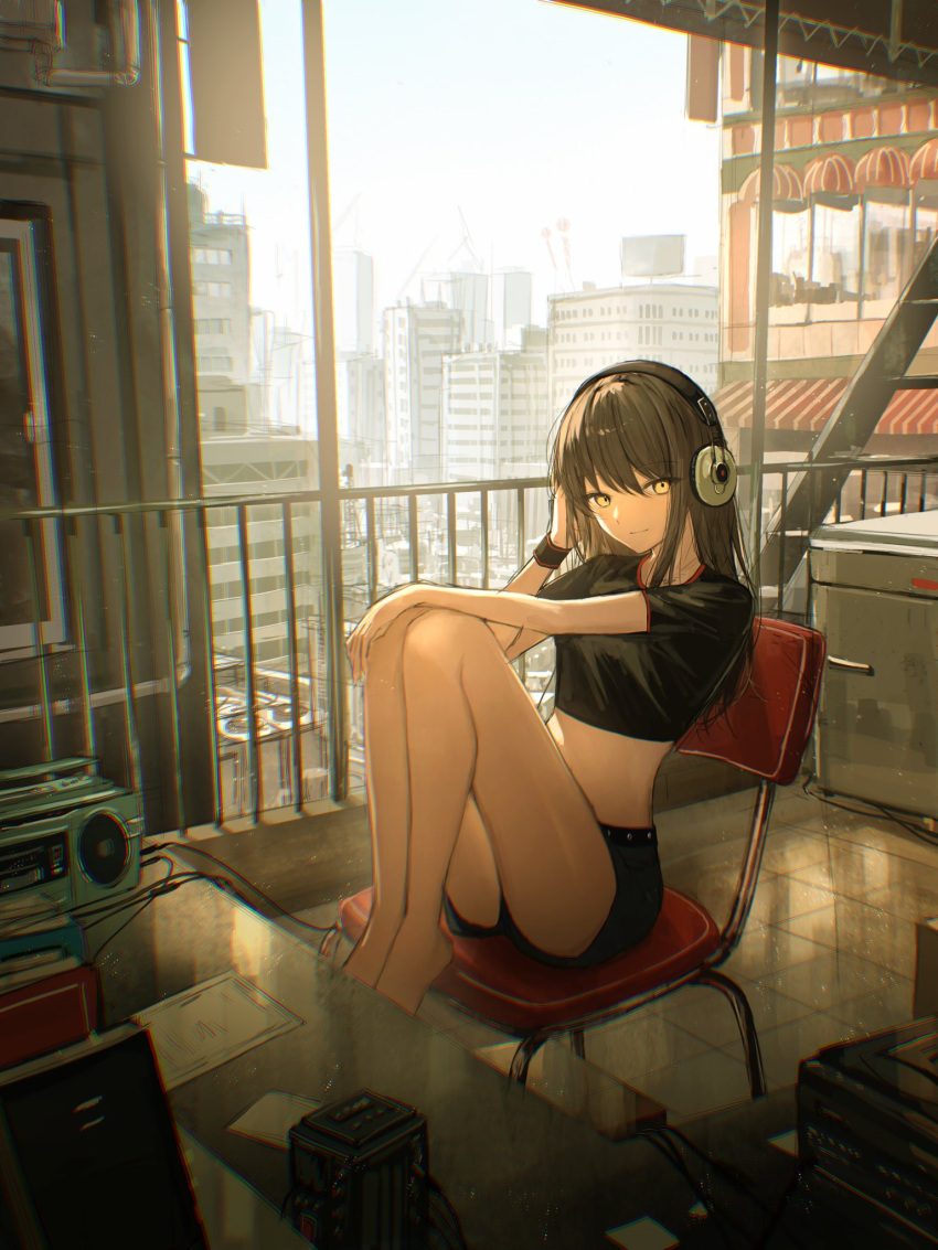 1girl awning bangs barefoot black_shirt black_shorts blush brown_hair building chair city cityscape closed_mouth desk hand_up headphones highres indoors knees_up looking_at_viewer medium_hair midriff original railing shirt short_shorts short_sleeves shorts sitting sky smile solo tamitami thighs yellow_eyes