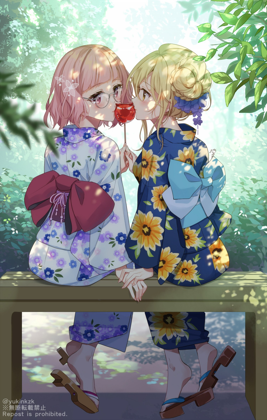 2girls back_bow bangs blonde_hair blue_bow blue_kimono blurry blurry_foreground blush bow braid candy_apple commentary_request depth_of_field english_text floral_print food from_behind glasses grey-framed_eyewear hair_bun highres holding holding_food japanese_clothes kimono multiple_girls nekozuki_yuki obi original parted_lips pink_hair print_kimono profile red_bow red_eyes round_eyewear sash shared_food sitting_on_bench tongue tongue_out twitter_username white_kimono yellow_eyes yukata yuri