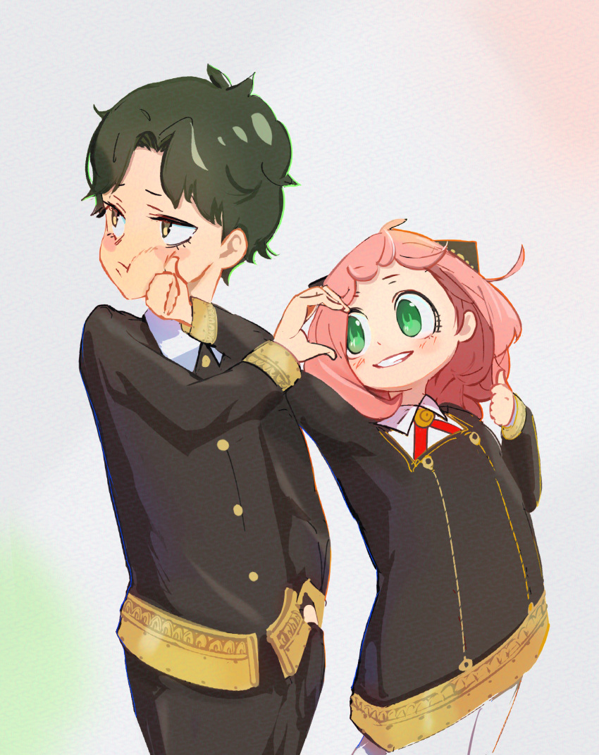 1boy 1girl :d absurdres ahoge anya_(spy_x_family) black_pants closed_mouth collared_shirt commentary_request cowboy_shot damian_desmond dot_nose eden_academy_uniform forehead gold_trim green_eyes green_hair hairpods hand_in_pocket hand_up heart_hands_invitation higemu highres long_hair long_sleeves looking_at_another open_mouth pants pink_hair pout shirt short_hair simple_background smile socks spy_x_family teeth thumbs_up white_background white_shirt white_socks yellow_eyes