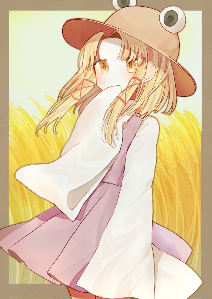 1girl bangs blonde_hair blush border brown_border brown_headwear commentary covered_mouth feet_out_of_frame hand_to_own_mouth hat highres long_hair long_sleeves moriya_suwako parted_bangs purple_skirt purple_vest sidelocks skirt solo symbol-only_commentary touhou turtleneck vest wheat_field wide_sleeves yellow_eyes yuejinlin