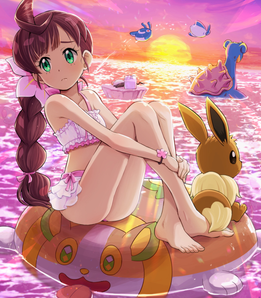 1girl absurdres afloat ahoge ass bangs bare_legs barefoot bracelet braid braided_ponytail brown_hair character_print chloe_(pokemon) closed_mouth collarbone commentary_request crossed_ankles eevee eiscue eiscue_(ice) eyelashes flower frills frown full_body green_eyes hair_flower hair_ornament highres innertube jewelry knees lapras long_hair looking_to_the_side mantyke outdoors own_hands_together pink_flower pokemoa pokemon pokemon_(anime) pokemon_(creature) pokemon_journeys sitting sky sunset swimsuit tentacool toes twilight water