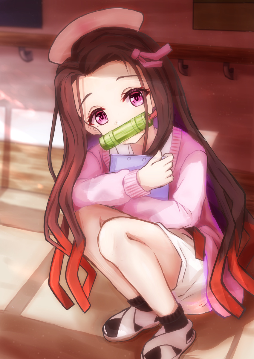 1girl absurdres bit_gag black_socks brown_hair cardigan clipboard colored_tips commentary dress full_body gag hair_ornament hat highres holding holding_clipboard i_tamima indoors kamado_nezuko kimetsu_no_yaiba long_hair long_sleeves looking_at_viewer multicolored_hair nurse nurse_cap object_hug pink_cardigan pink_eyes pink_ribbon red_hair ribbon socks solo squatting streaked_hair very_long_hair white_dress white_footwear