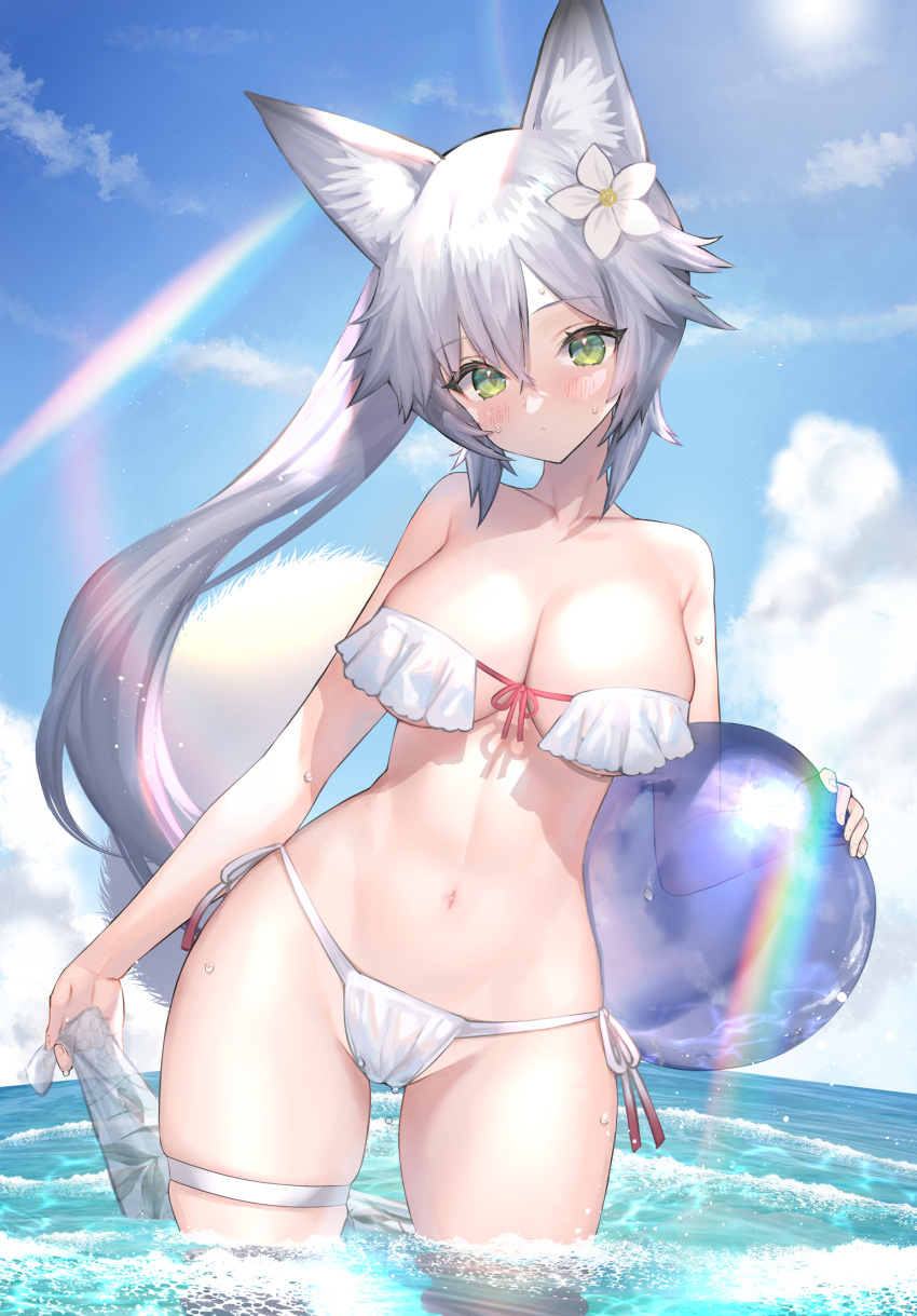 1girl alternate_costume animal_ear_fluff animal_ears ball bangs beachball bikini blue_sky blush breasts cleavage closed_mouth cloud collarbone contrapposto day flower green_eyes grey_hair hair_flower hair_ornament head_tilt highres hitowa holding large_breasts lens_flare long_hair looking_at_viewer navel ocean original ponytail sarong sarong_removed skindentation sky solo stomach strapless strapless_bikini sunlight swimsuit thigh_strap water white_bikini white_flower