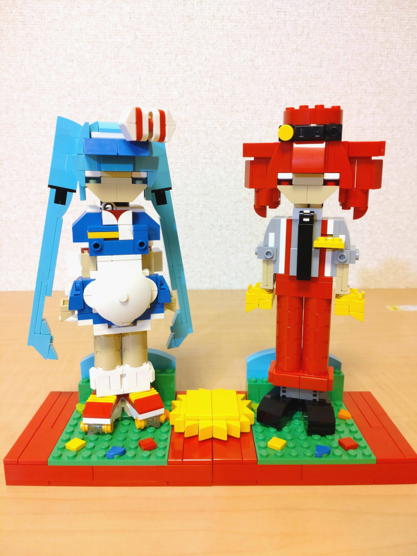 2girls alternate_costume apron arms_at_sides black_footwear black_necktie blue_dress blue_eyes blue_hair bow choroli_(chorolin) commentary dress drill_hair full_body gloves grey_shirt hair_bow hat hatsune_miku highres kasane_teto lego_(medium) long_hair looking_at_viewer mesmerizer_(vocaloid) multiple_girls necktie pants red_eyes red_footwear red_hair red_hat red_pants roller_skates shirt shoes short_dress short_sleeves skates sleeves_rolled_up socks standing striped_bow suspenders twin_drills twintails unconventional_media utau very_long_hair vocaloid white_apron white_socks yellow_gloves