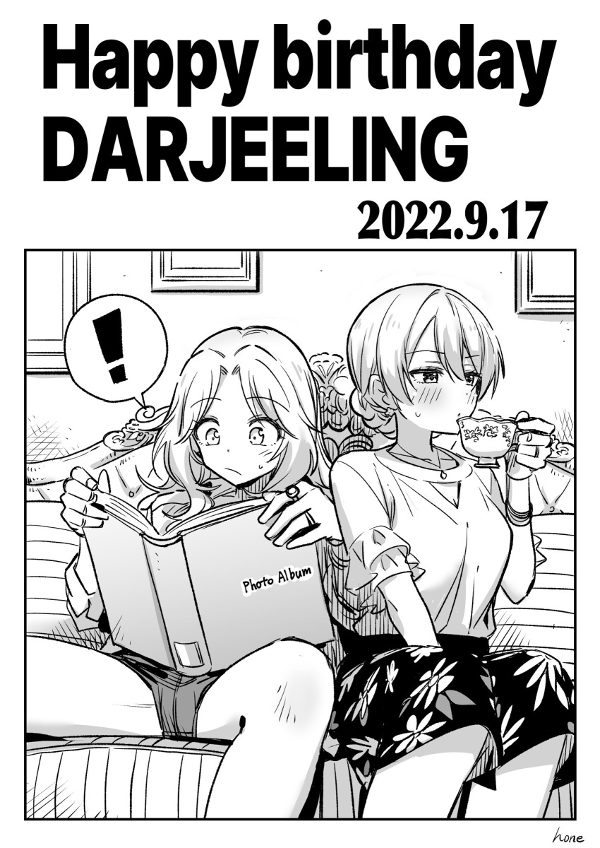 2girls blouse blush couch cup darjeeling_(girls_und_panzer) dated girls_und_panzer happy_birthday highres hone_(honehone083) jewelry kay_(girls_und_panzer) long_hair monochrome multiple_girls photo_album ring shirt short_shorts shorts sitting skirt spread_legs teacup