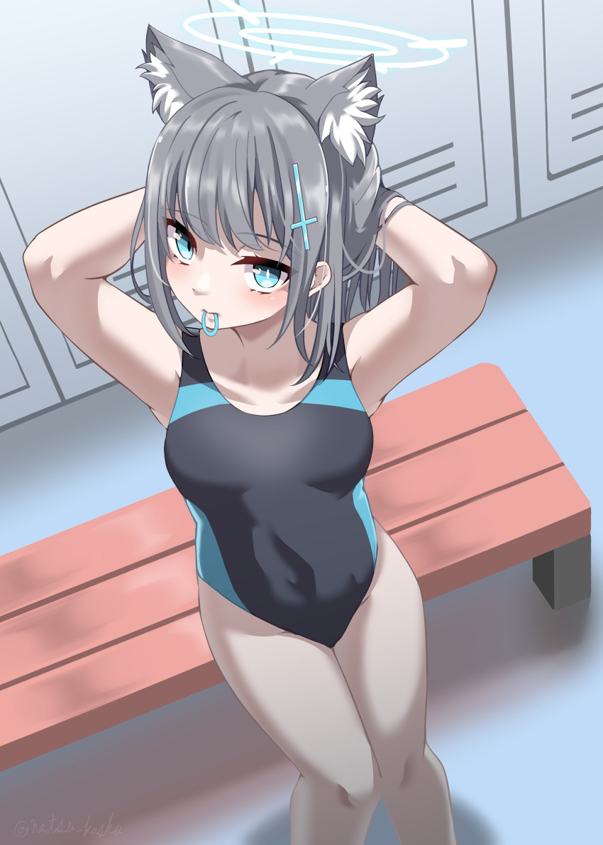 1girl animal_ear_fluff animal_ears arms_behind_head bangs bench black_one-piece_swimsuit blue_archive blue_eyes breasts competition_swimsuit covered_navel cross_hair_ornament extra_ears from_above grey_hair hair_ornament hair_tie halo highres locker looking_at_viewer low_ponytail medium_breasts medium_hair mismatched_pupils mouth_hold multicolored_clothes multicolored_swimsuit one-piece_swimsuit ramiel1111 rubber_band shiroko_(blue_archive) shiroko_(swimsuit)_(blue_archive) standing swimsuit