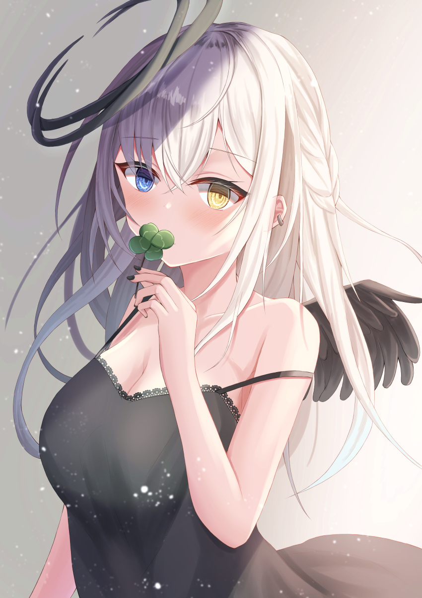 1girl absurdres angel_wings bangs black_dress black_nails black_wings blue_eyes blurry blush breasts cleavage clover covering_face depth_of_field dress ear_piercing four-leaf_clover grey_hair halo heterochromia highres holding_clover hutaba_miyagi large_breasts light light_particles long_hair off_shoulder original piercing sidelocks smile standing upper_body white_hair wings yellow_eyes