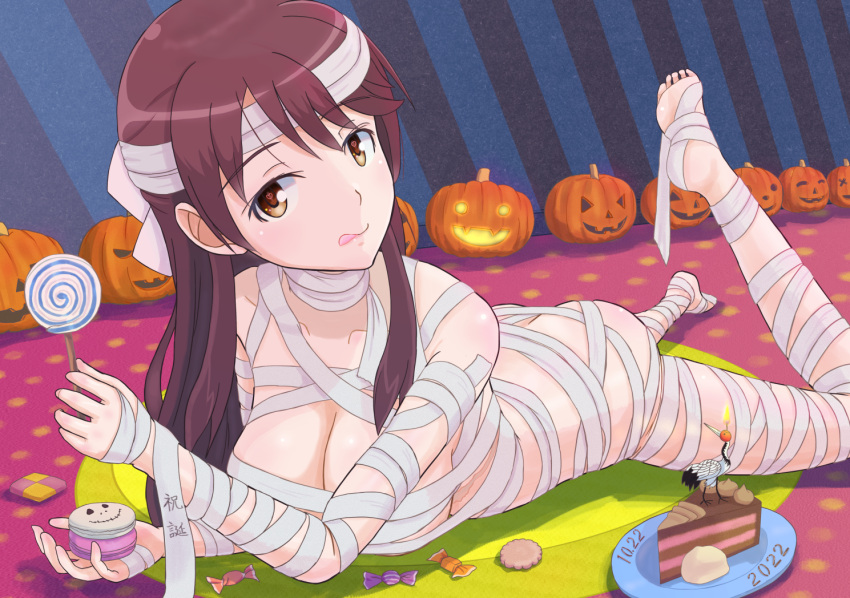 1girl ass bandages blush brave_witches breasts brown_eyes brown_hair butt_crack cake candy cleavage closed_mouth collarbone cookie food halloween jack-o'-lantern karibuchi_takami keicha_(kmoekaki) large_breasts lollipop long_hair lying mummy_costume on_stomach shiny shiny_hair shiny_skin solo tongue tongue_out world_witches_series