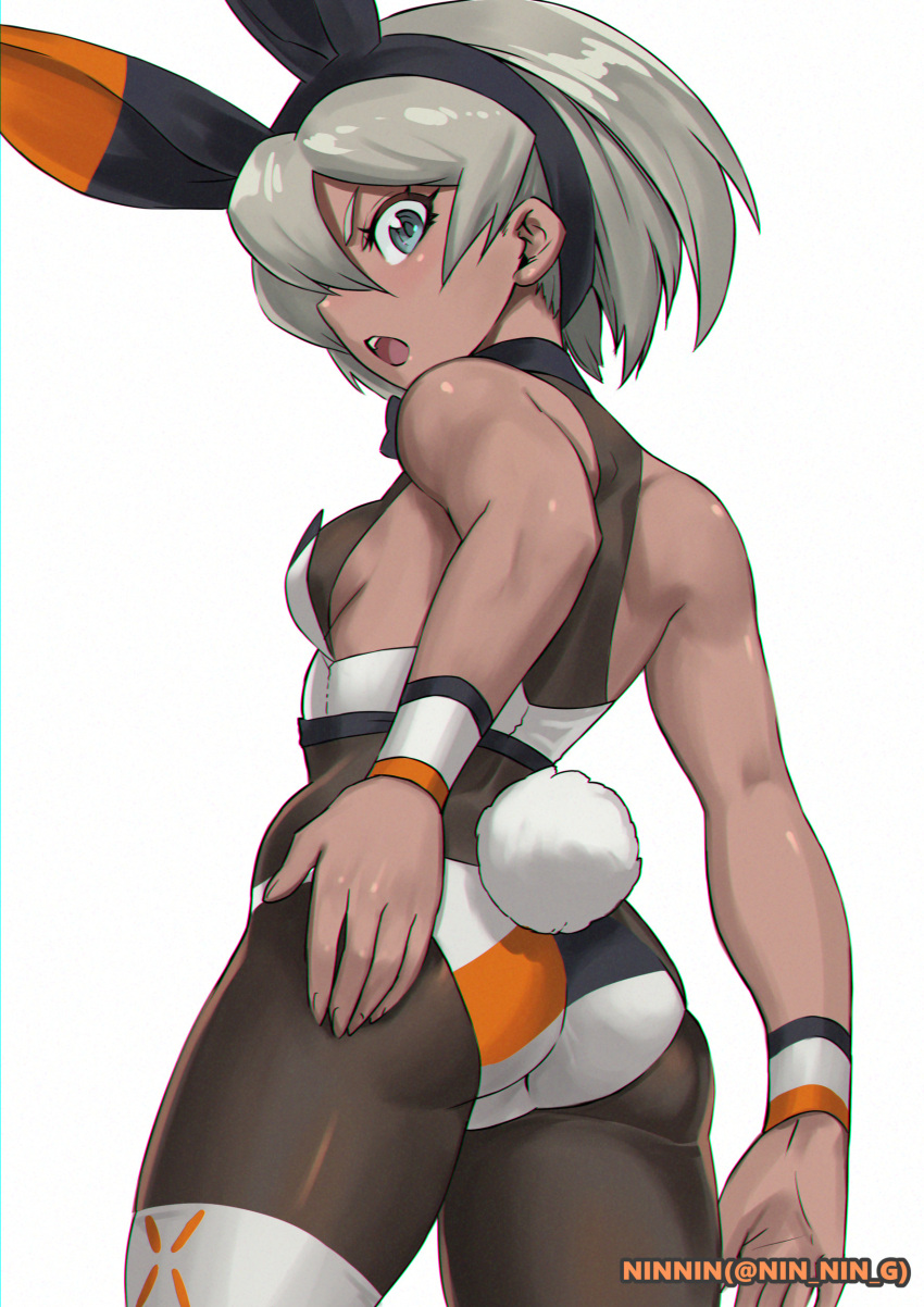 1girl :o absurdres adapted_costume artist_name ass bangs bea_(pokemon) black_hairband breasts commentary_request cowboy_shot dark-skinned_female dark_skin from_behind grey_hair hairband highres leotard ninnin_(shishitou) open_mouth pokemon pokemon_(game) pokemon_swsh rabbit_tail short_hair simple_background solo tail teeth tongue twitter_username upper_teeth wedgie white_background wristband