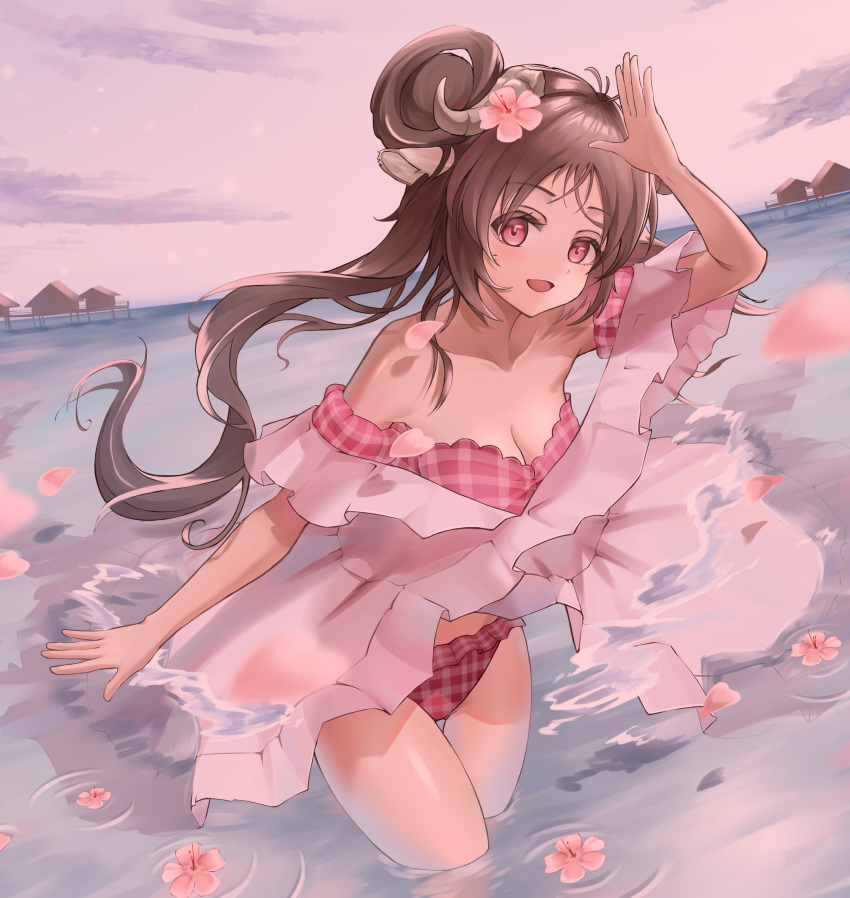 1girl :d absurdres animal_ears arknights arm_up bare_shoulders bikini bikini_under_clothes breasts brown_hair building cleavage cloud commentary_request day eyjafjalla_(arknights) eyjafjalla_(summer_flowers)_(arknights) flower flower_on_liquid forehead frills hair_flower hair_ornament highres horizon horns long_hair looking_at_viewer medium_breasts nobigmouse ocean outdoors petals pink_bikini pink_flower plaid plaid_bikini red_eyes sheep_ears sheep_girl sheep_horns sky smile solo standing strapless strapless_bikini swimsuit very_long_hair wading water