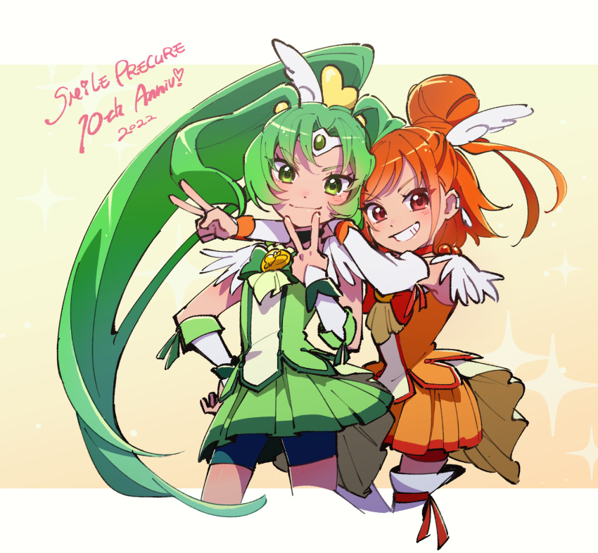 2022 2girls anniversary bike_shorts bike_shorts_under_skirt boots commentary_request copyright_name cure_march cure_sunny dress english_text eyelashes green_dress green_eyes green_hair hair_bun hair_ornament happy highres hino_akane_(smile_precure!) long_hair looking_at_viewer magical_girl medium_hair midorikawa_nao multiple_girls orange_dress orange_eyes orange_hair ponytail precure short_hair shorts shorts_under_skirt single_hair_bun smile smile_precure! standing thigh_boots thighhighs tri_tails ukata v wrist_cuffs