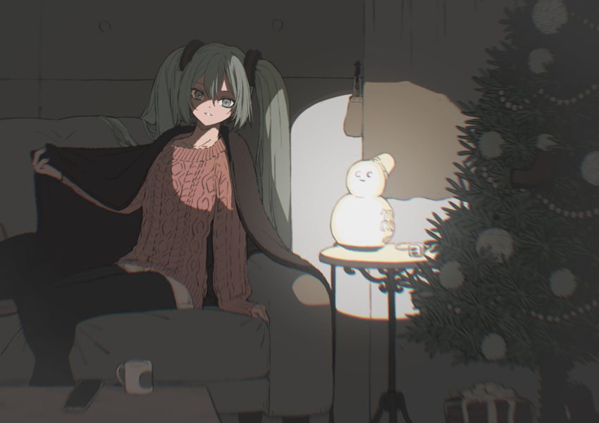 1girl arm_support bangs beckoning black_pantyhose blanket blurry box cellphone christmas christmas_ornaments christmas_tree commentary couch cup curtains depth_of_field english_commentary gift gift_box green_eyes green_hair hair_between_eyes hatsune_miku indoors legwear_under_shorts long_hair long_sleeves looking_at_viewer mug outstretched_arm pantyhose phone plug red_sweater shorts sitting sleeves_past_wrists snowman solo stage_lights suzukou sweater table twintails under_covers vocaloid wooden_table