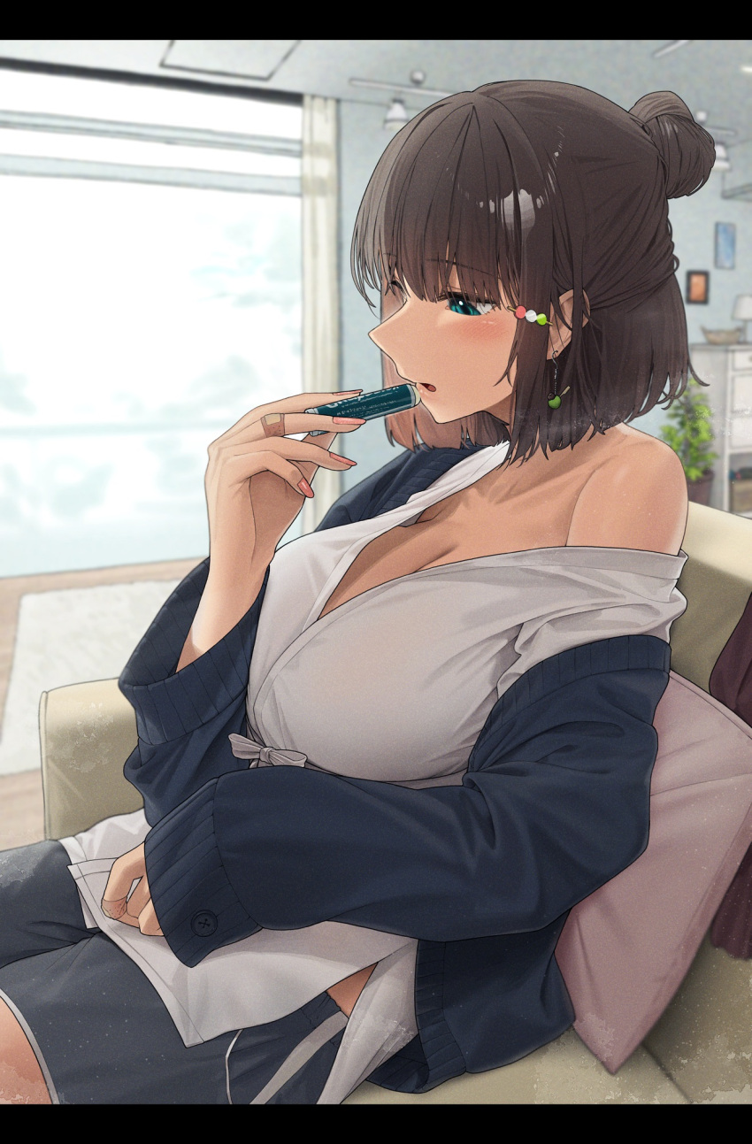 1girl bandaid bandaid_on_hand blue_eyes blush breasts brown_hair cleavage cosmetics couch dango_hair_ornament food-themed_hair_ornament from_side hair_bun hair_ornament highres holding holding_lipstick_tube indoors jacket large_breasts lipstick_tube long_sleeves noeru off_shoulder on_couch open_clothes open_jacket original parted_lips pink_nails plant potted_plant shirt short_hair shorts single_bare_shoulder single_hair_bun sitting solo white_shirt