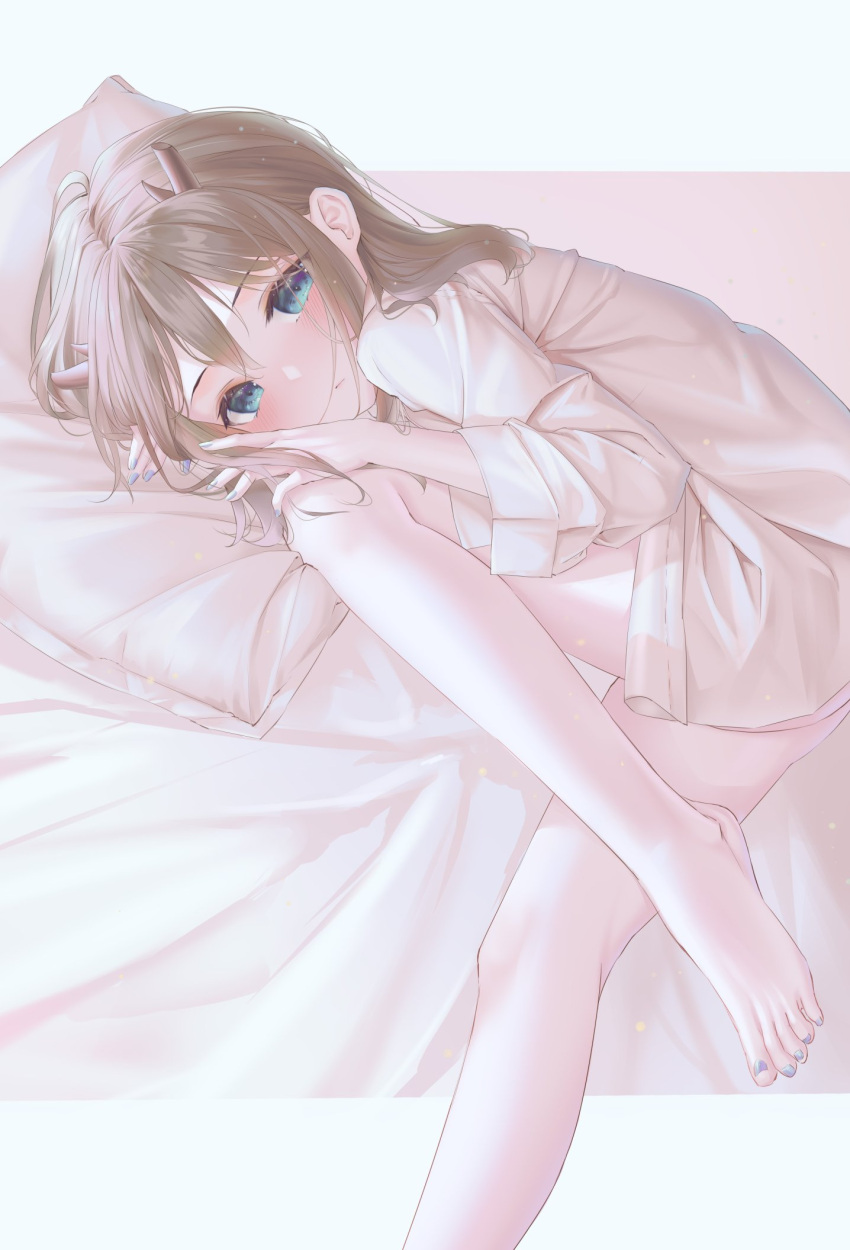 1girl amaroku_neko bangs barefoot bed_sheet blue_eyes blue_nails blush brown_hair commentary_request eyelashes feet foot_out_of_frame hair_between_eyes hand_up highres horns indie_virtual_youtuber kano_(singer) knee_up legs long_hair long_legs long_sleeves looking_at_viewer lying nail_polish on_side oversized_clothes oversized_shirt pillow shadow shiny shiny_clothes shiny_hair shirt sidelocks sleepwear solo thighs toenail_polish toenails toes