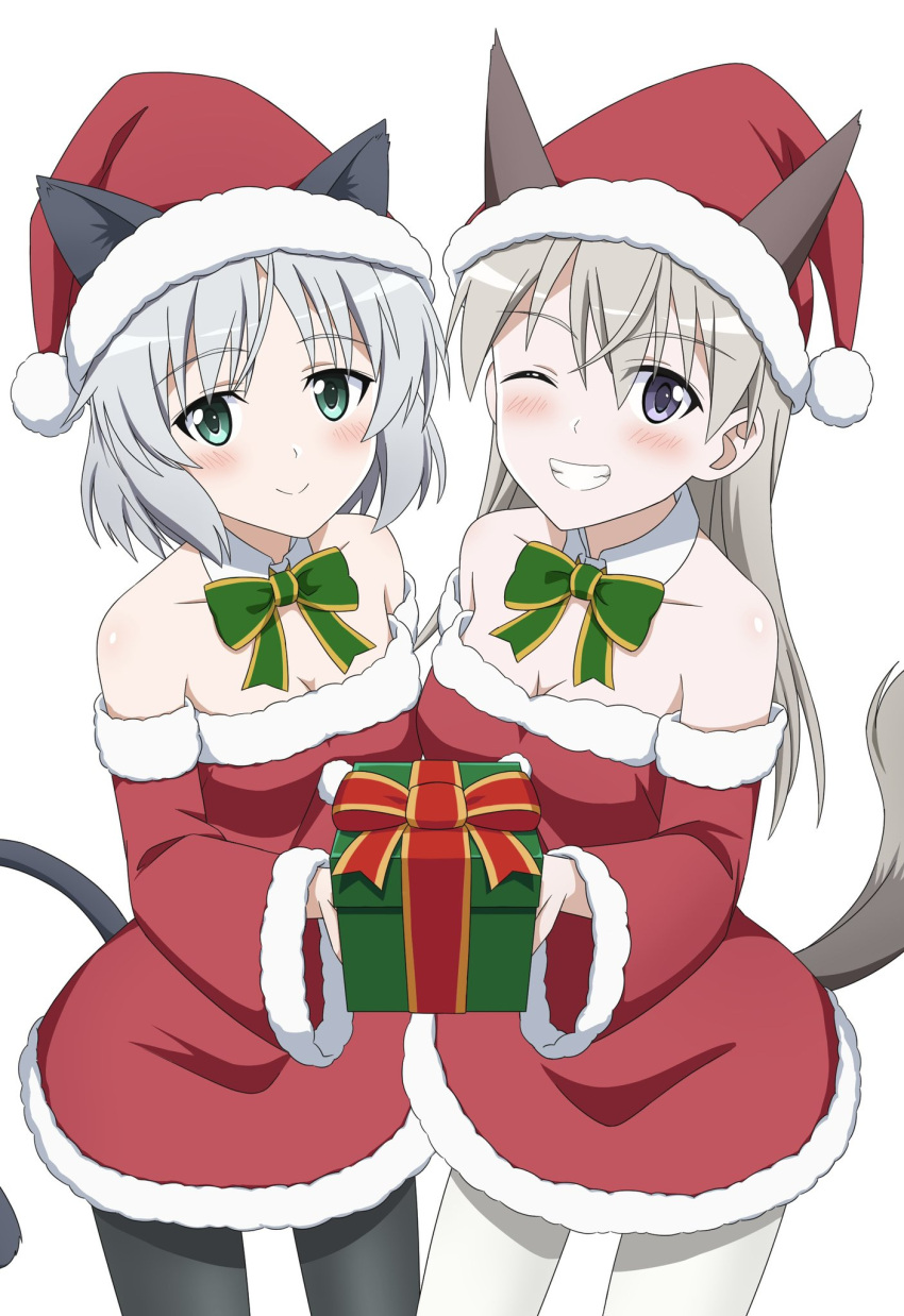 2girls ;) animal_ears bare_shoulders black_pantyhose blue_eyes bow bowtie box breasts cat_ears cat_girl cat_tail cleavage cowboy_shot detached_collar detached_sleeves dress ears_through_headwear eila_ilmatar_juutilainen fox_ears fox_girl fox_tail fur-trimmed_dress fur-trimmed_sleeves fur_trim gift gift_box green_bow green_bowtie green_eyes grey_hair hat highres holding holding_gift kanata_mako long_hair looking_at_viewer medium_breasts multiple_girls one_eye_closed pantyhose purple_eyes santa_costume santa_hat sanya_v._litvyak short_hair simple_background smile strike_witches tail white_background white_pantyhose world_witches_series