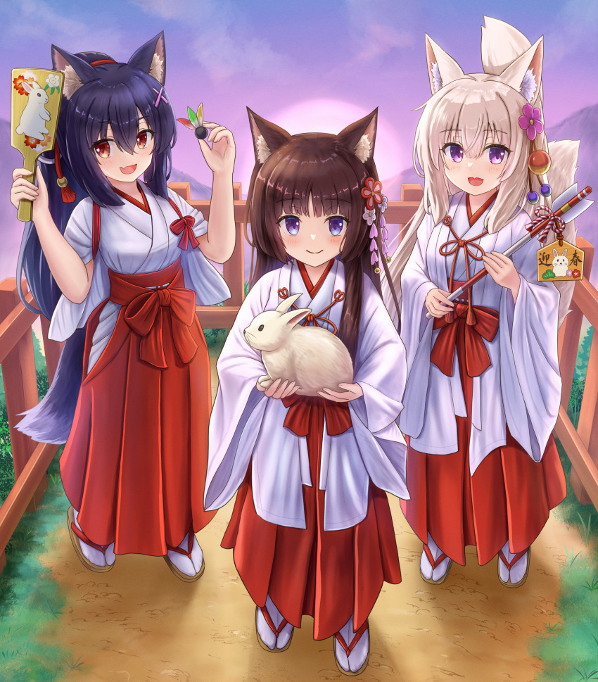 3girls :d absurdres animal animal_ear_fluff animal_ears arrow_(projectile) bangs black_hair brown_eyes brown_footwear brown_hair cat_ears chinese_zodiac closed_mouth commentary_request ema fang flower folded_ponytail fox_ears fox_girl fox_tail full_body hagoita hair_between_eyes hair_flower hair_ornament hakama hakama_skirt hamaya hane_(hanetsuki) highres holding holding_animal holding_arrow iroha_(iroha_matsurika) japanese_clothes kimono koyoi_(iroha_(iroha_matsurika)) kunoichi-chan_(iroha_(iroha_matsurika)) long_hair long_sleeves looking_at_viewer miko multiple_girls mutsuki_(iroha_(iroha_matsurika)) original outdoors paddle pink_flower purple_eyes rabbit railing red_hakama short_sleeves skirt smile socks sunrise tabi tail tasuki very_long_hair white_kimono white_socks wide_sleeves wolf_ears wolf_girl wolf_tail year_of_the_rabbit zouri