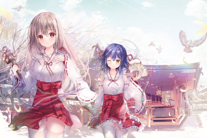 2girls ;q animal bangs bare_tree bell bird blue_hair blue_sky blush breasts brown_hair building closed_mouth cloud commentary_request day folding_fan frills hair_between_eyes hakama hakama_short_skirt hakama_skirt hand_fan highres holding holding_fan japanese_clothes jingle_bell kagura_suzu kimono long_hair long_sleeves looking_at_viewer maeda_shiori medium_breasts miko multiple_girls nanami_yuuno one_eye_closed outdoors red_eyes red_hakama ribbon_trim skindentation skirt sky sleeves_past_wrists smile snow sousouman thighhighs tongue tongue_out tree twinbox_school very_long_hair white_kimono white_thighhighs wide_sleeves yellow_eyes