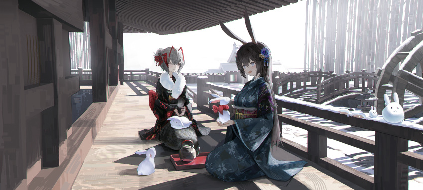 2girls :d absurdres amiya_(arknights) animal_ears arknights bangs black_kimono blue_eyes blue_flower blue_kimono brown_hair closed_mouth flower full_body grey_eyes grey_hair hair_flower hair_ornament highres holding japanese_clothes kimono multiple_girls new_year obi open_mouth rabbit rabbit_ears rabbit_girl roupo99 sash seiza sitting smile snow snowing w_(arknights) white_sky wooden_floor