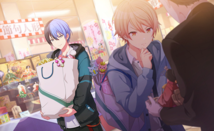 2boys aoyagi_touya bag bangs blonde_hair blue_hair closed_mouth colorful_palette dark_blue_hair doll gradient_hair grey_eyes hair_between_eyes hand_on_own_chin highres holding holding_bag hood hood_down hooded_jacket jacket kanji long_sleeves male_focus mole mole_under_eye multicolored_hair multiple_boys official_art open_clothes open_jacket orange_eyes orange_hair project_sekai short_hair sign tenma_tsukasa third-party_source