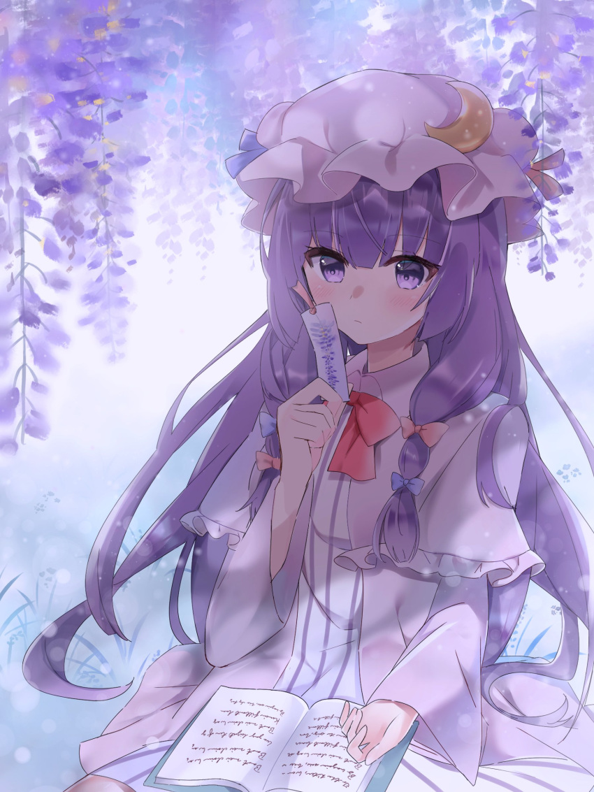 1girl absurdres blue_bow blush book bookmark bow bowtie closed_mouth commentary crescent crescent_hat_ornament dress flower hair_bow hat hat_ornament hidukihumi highres holding_bookmark long_hair long_sleeves looking_at_viewer mob_cap open_book outdoors patchouli_knowledge purple_eyes purple_flower purple_hair red_bow red_bowtie sitting solo striped_clothes striped_dress touhou vertical-striped_clothes vertical-striped_dress