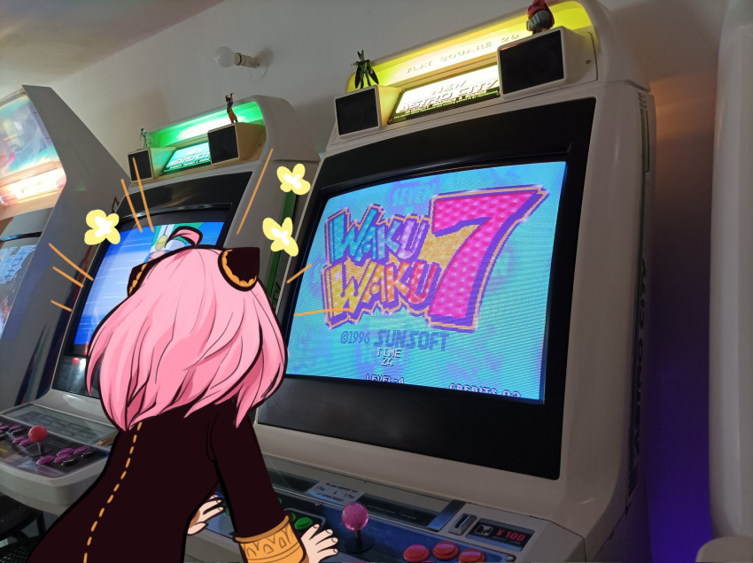 1girl anya_(spy_x_family) arcade arcade_cabinet arcade_stick child cone_hair_bun controller eden_academy_school_uniform female_child game_controller hair_bun hairpods highres indoors joystick meta photo-referenced pink_hair realistic school_uniform solo spy_x_family syl_phy video_game waku_waku_7